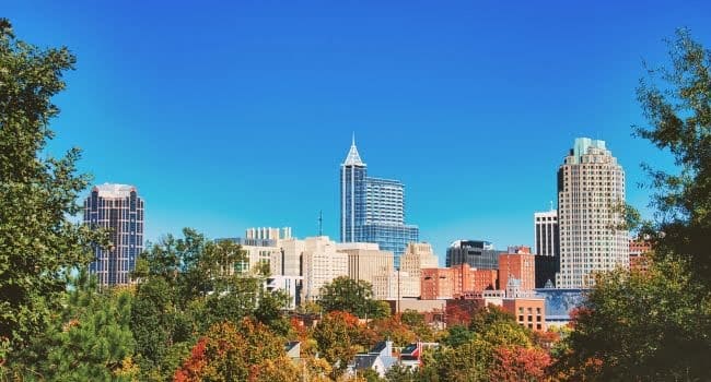 Autumn afternoon skyline of downtown Raleigh, North Carolina, symbolizing its rise as a key destination for real estate investors in 2024.
