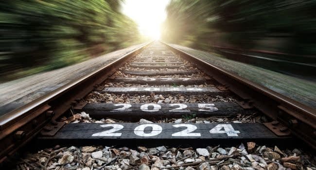 Empty railroad with new year number 2024, 2025, representing achievement and forward planning beyond 2024.