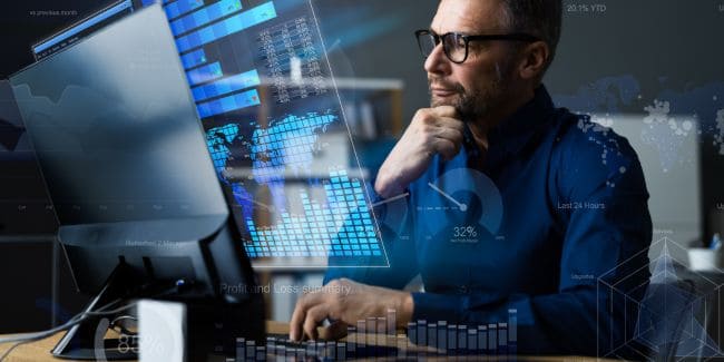 Image showing an investor scrutinizing market graphs and indicators on a screen, highlighting the powerful role of investor sentiment in shaping market trends and influencing investment decisions